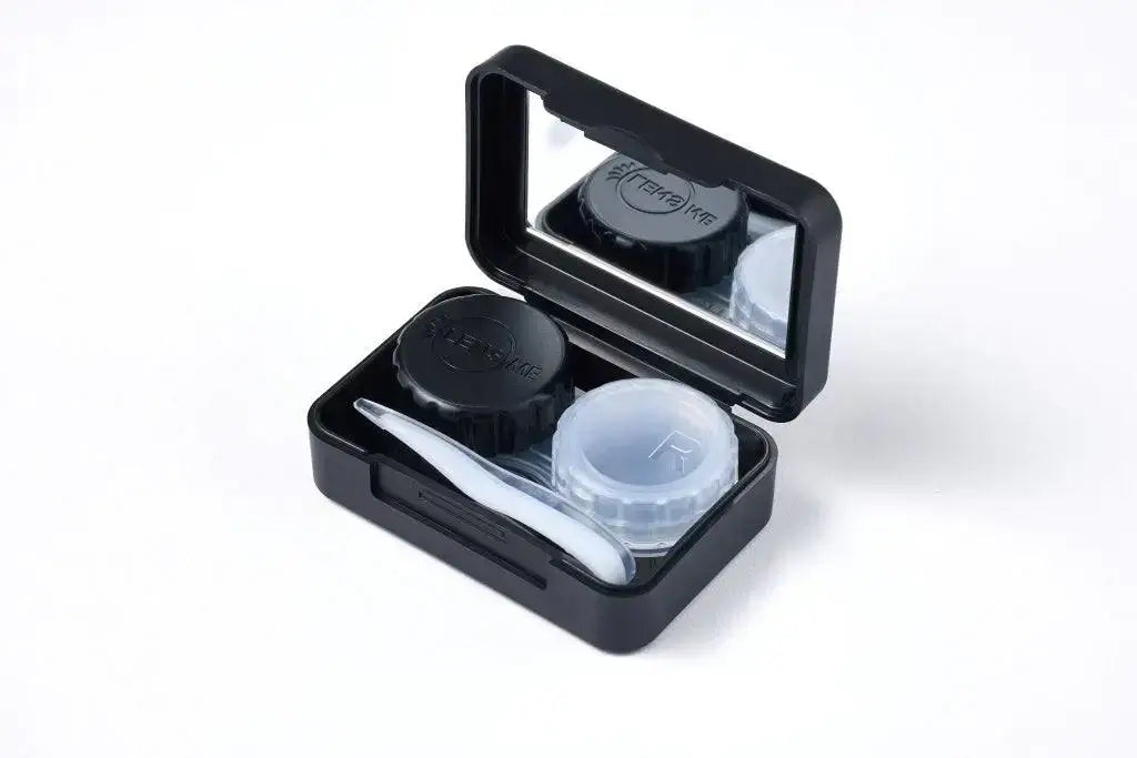 TORICA black lens case with tweezers and mirror, perfect for contact lens storage and travel.