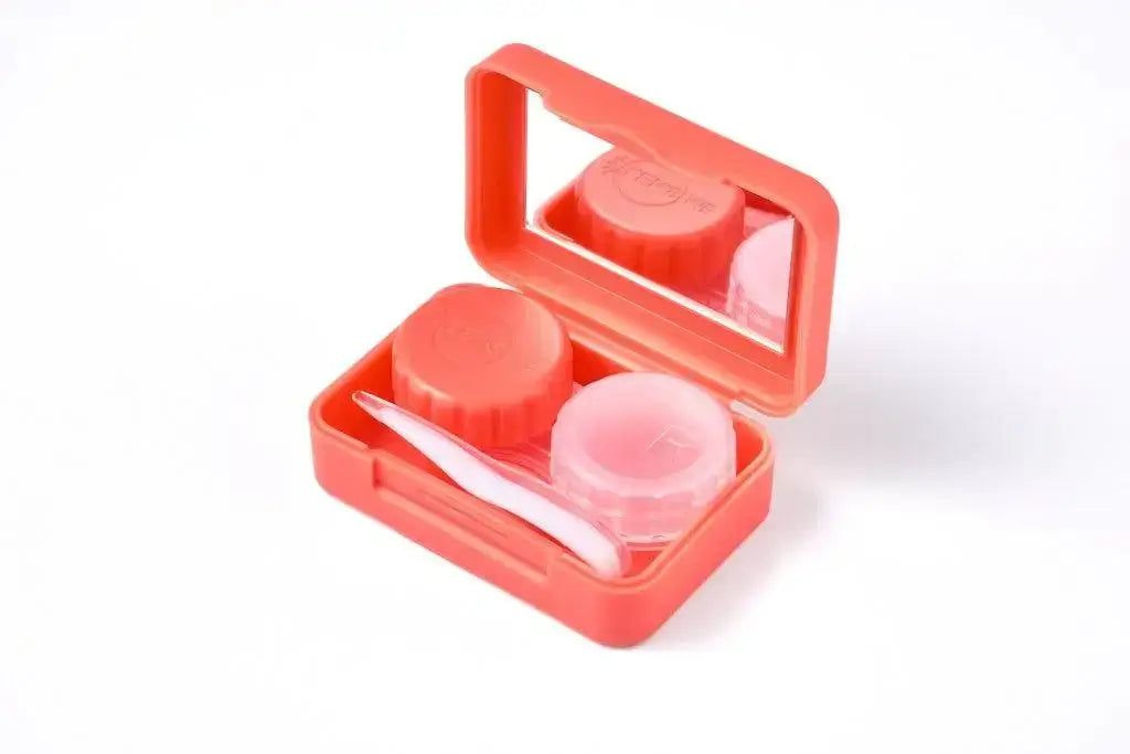 Orange TORICA lens case with mirror, storage compartments, and tweezer. Perfect travel accessory for lens care. Limited edition colors.