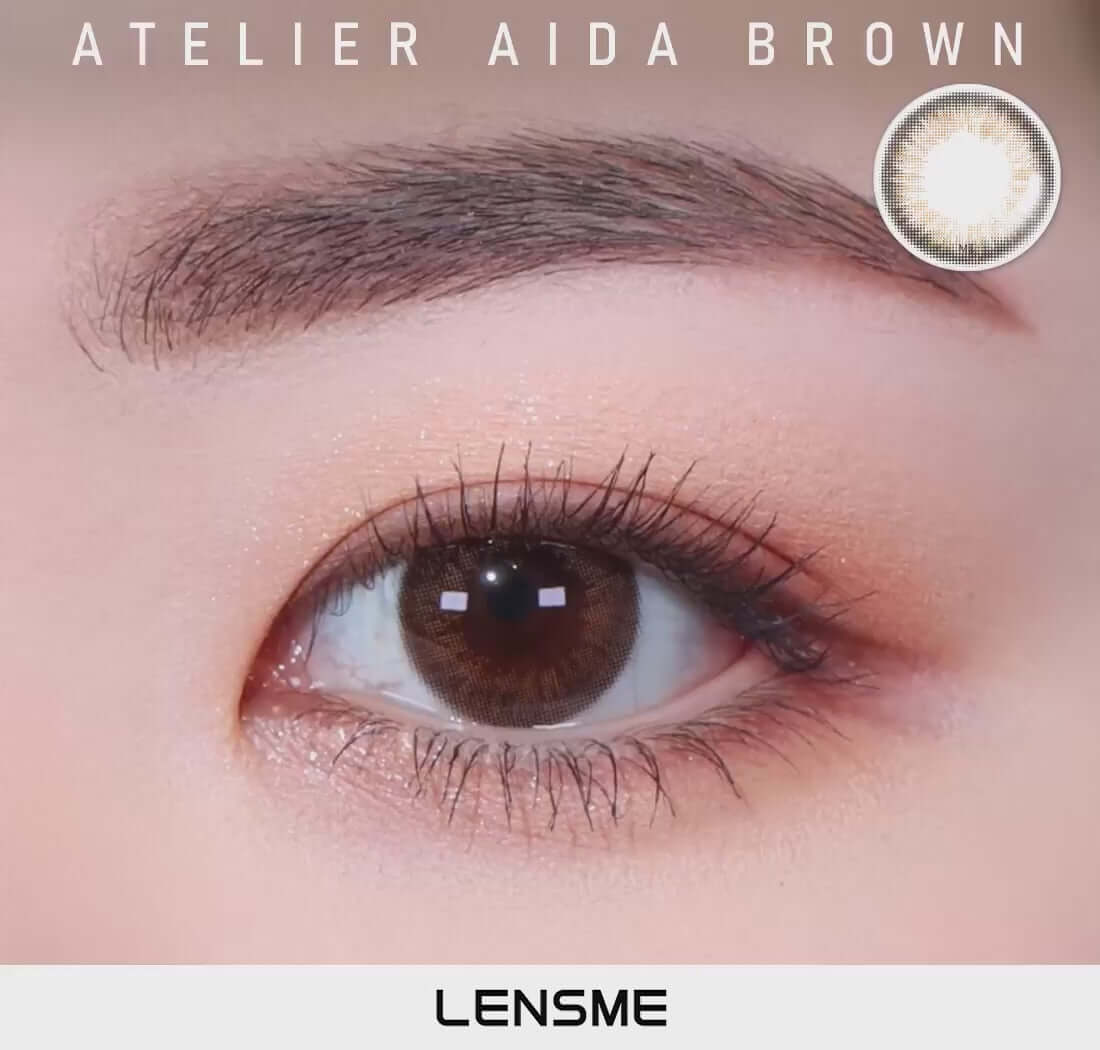 Brown toric contact lens showcasing a delicate iris design for vivid eyes. Lensme Aida Brown offering daily to yearly replacement options.