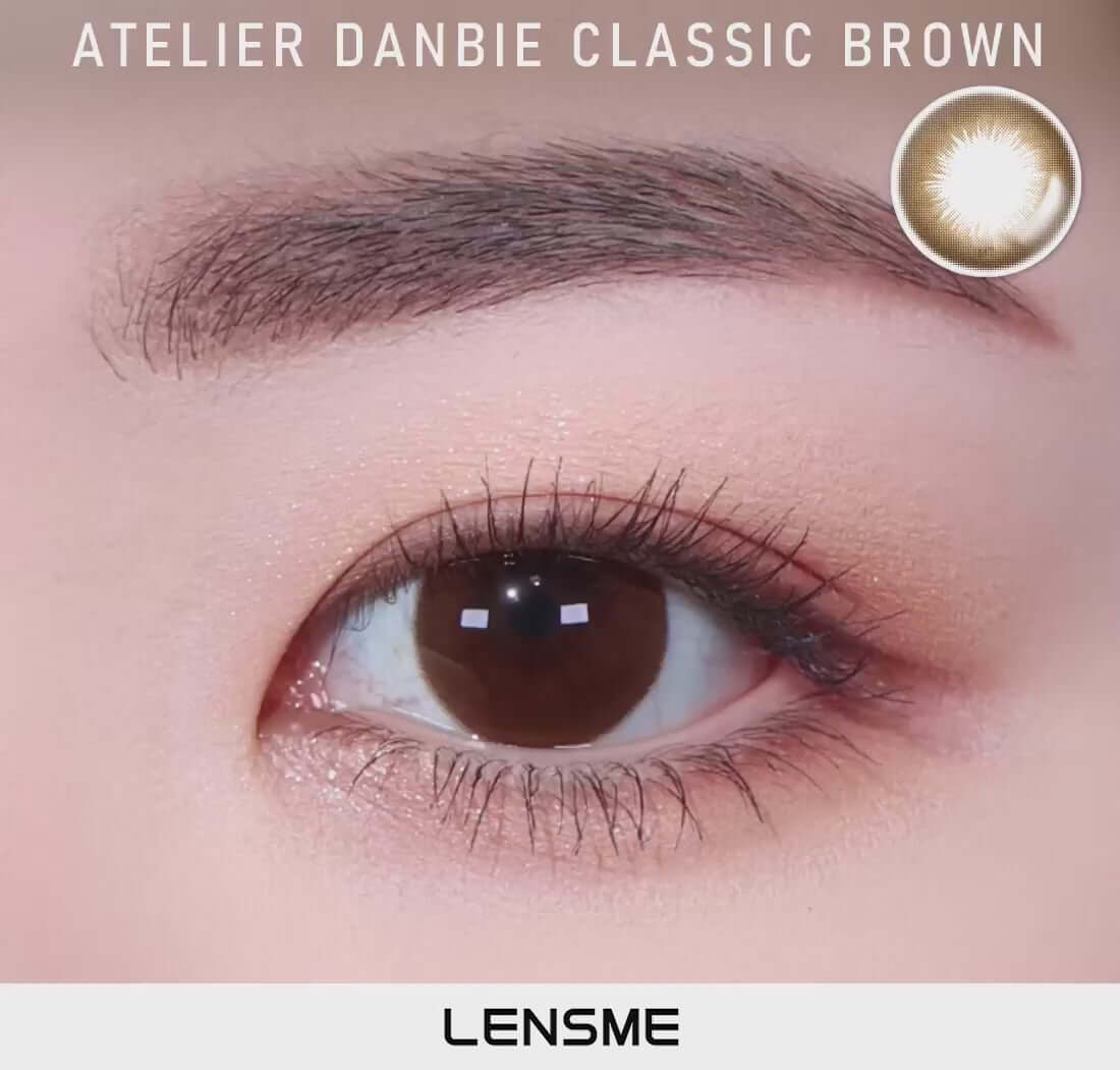 Close-up of an eye wearing Danbie Classic Brown toric contact lens with a natural brown color, suitable for all replacement schedules.