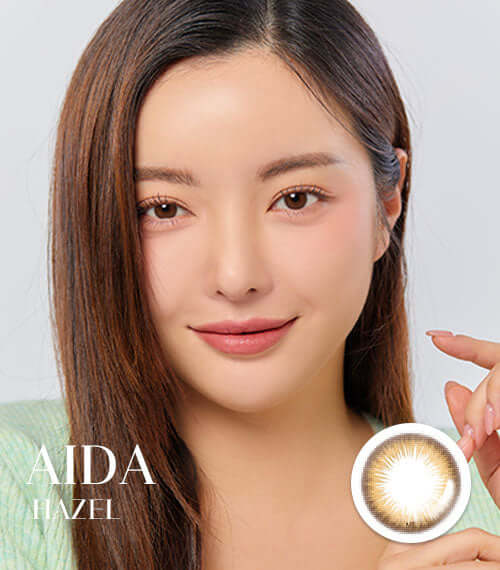 Woman wearing Aida Hazel toric contacts with 14.2mm diameter, showcasing hazel iris design for light pigmented eyes, product ID K018BR.