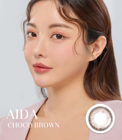 Alt Tag: Aida Choco Brown toric contact lenses in chocolate color, featuring delicate iris design, worn by model. Product ID: K020CH.