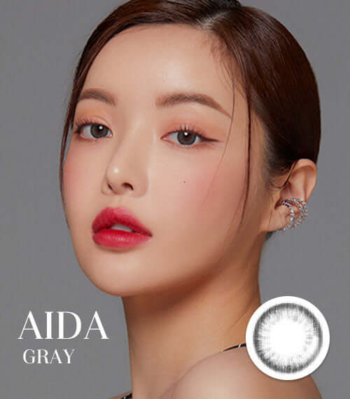 Aida Gray toric contact lenses with smokey gray color; DIA 14.2, G.DIA 13.4, BC 8.6; enhances eyes with glossy, cool look.