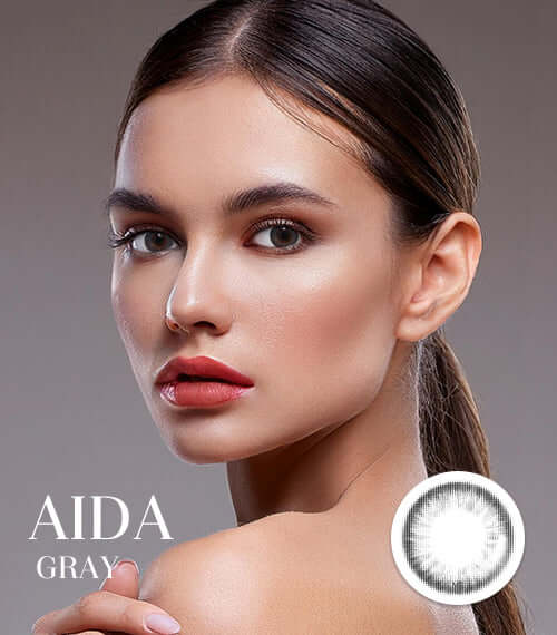 Model wearing Aida Gray toric contact lenses, featuring smokey gray color for a glossy, sophisticated look. Product ID: K019GR.
