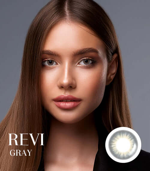 Woman wearing Revi Gray toric lenses, showing mature half eyes in transparent gray color. Small size with 55% water content.